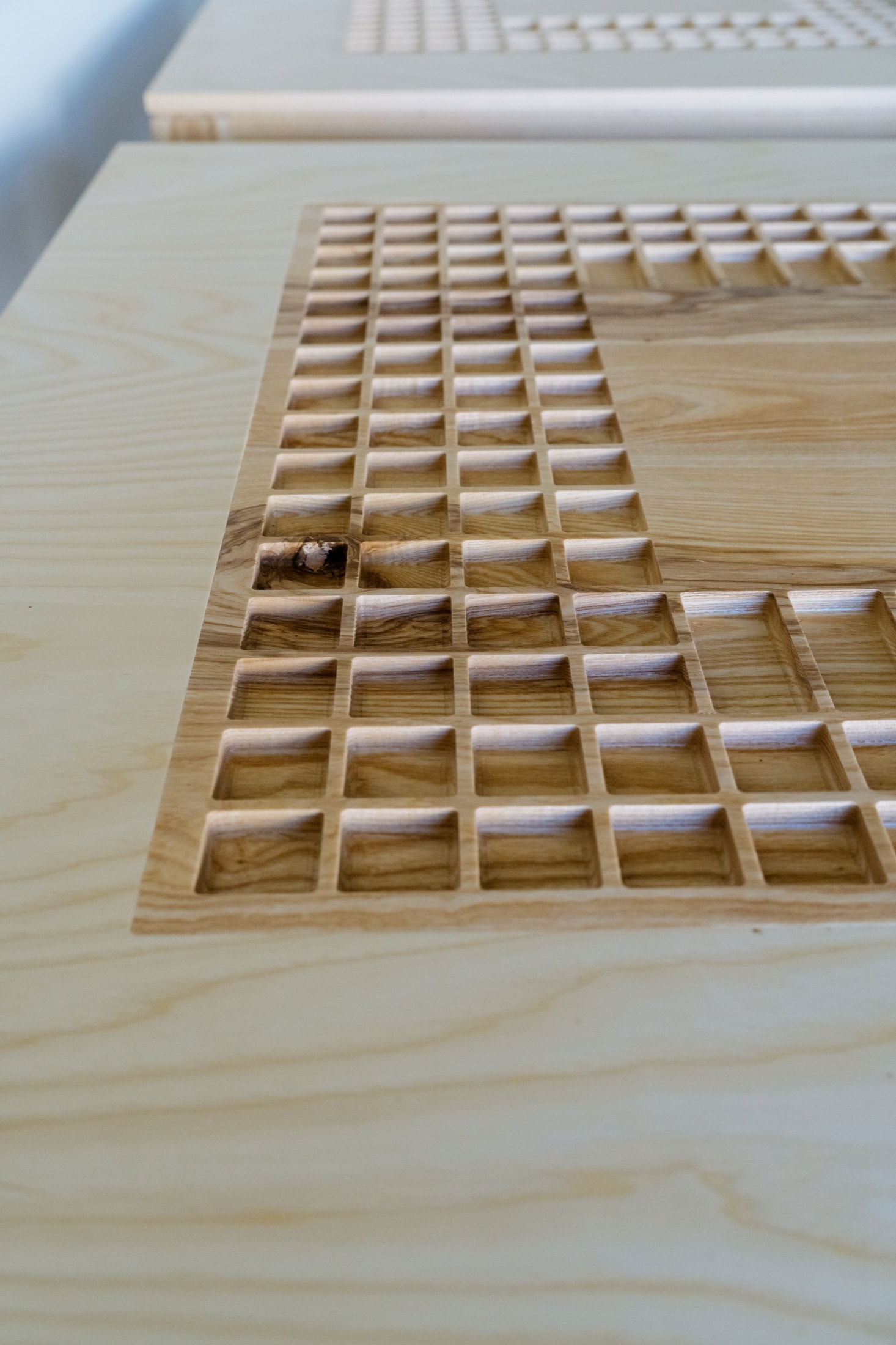Routed tray detail on charm table surface, City + Stars Midtown Oklahoma City